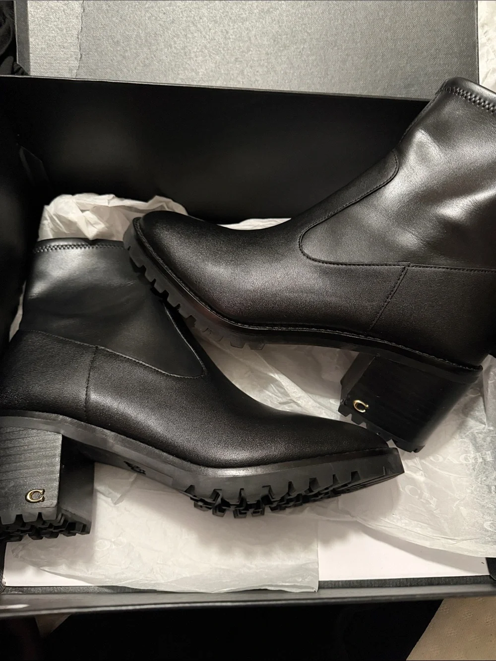 Coach Black Leather Lug Sole Ankle Boots with Gold Zip Accent